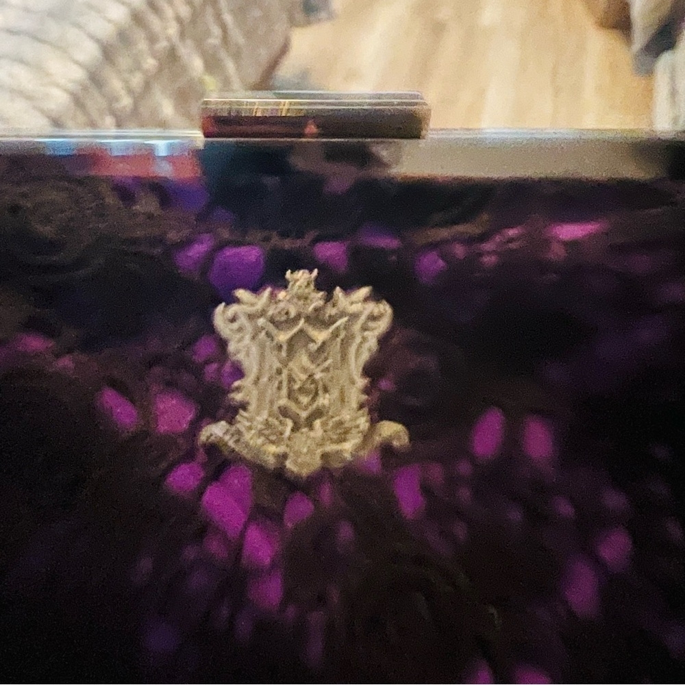 Disney original 45th Anniversary. Purple and Black Clutch with Gold Emblem.